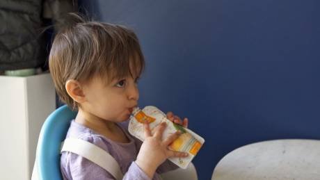 Isla eating squeeze pouch